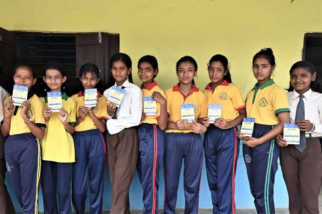 A group of students wait in line to get vaccinated against Measles-Rubella during the Outbreak Response Immunization campaign in Mahottari district of Madhesh Province.